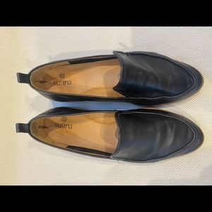 Black leather flats